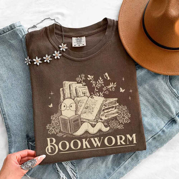 May include Bookworm Comfort Colors t-shirt with book lover graphic, relaxed unisex fit, and garment-dyed cotton