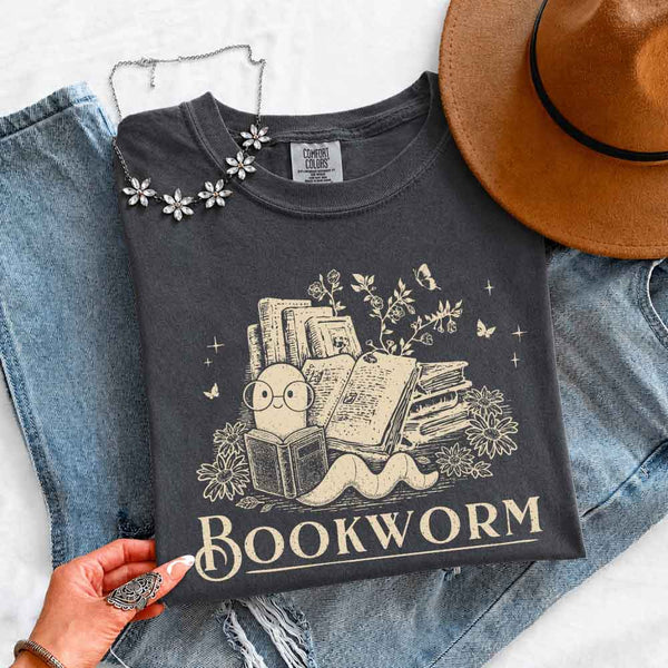 May include Bookworm Comfort Colors t-shirt with book lover graphic, relaxed unisex fit, and garment-dyed cotton