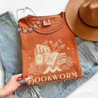May include Bookworm Comfort Colors t-shirt with book lover graphic, relaxed unisex fit, and garment-dyed cotton