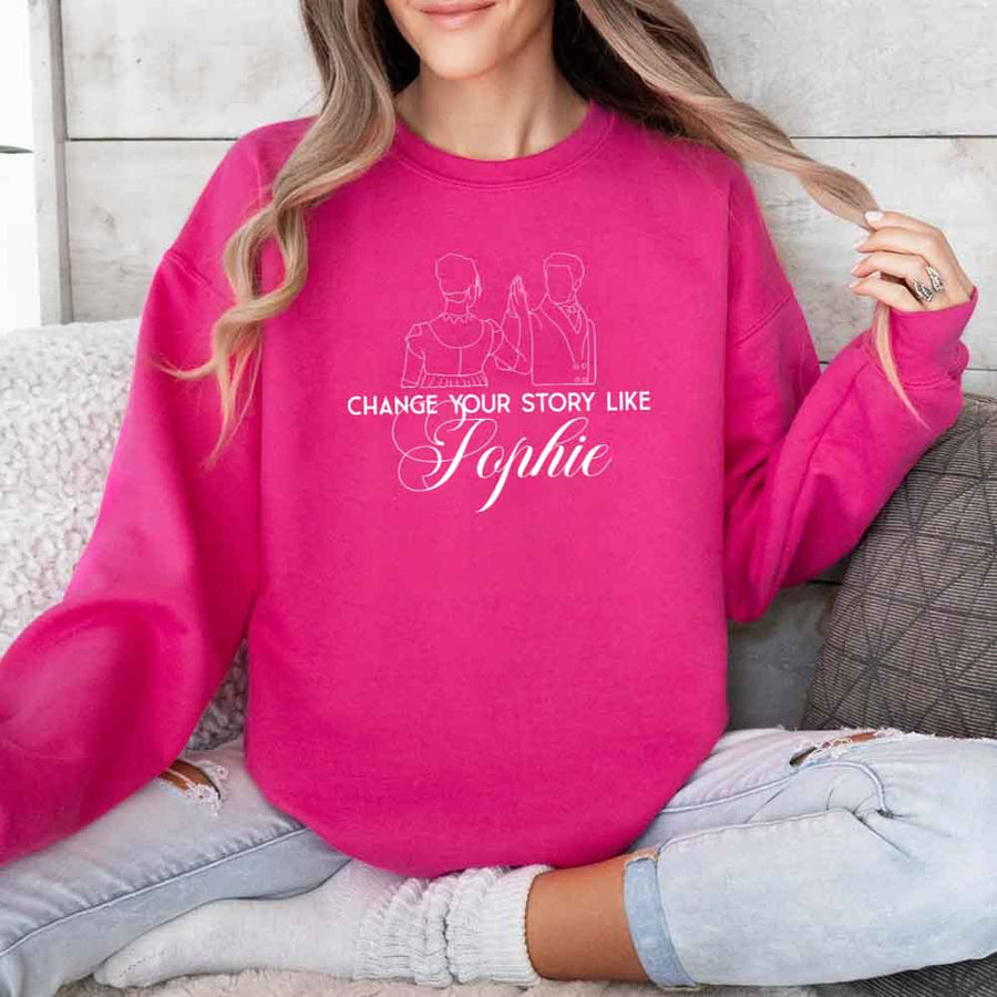 May include a person wearing a Heliconia Change Your Story Like Sophie Crewneck Sweatshirt featuring royal inspired graphic and classic fit.