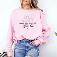 May include a person wearing a Pink Change Your Story Like Sophie Crewneck Sweatshirt featuring royal inspired graphic and classic fit.