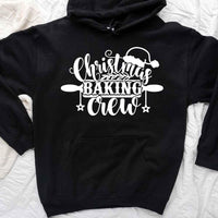 May include a festive t-shirt reading “Christmas Baking Crew” with cookie or whisk graphics, displayed flat or worn, ideal for holiday baking groups.