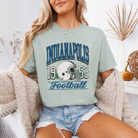 May include a City Football Comfort Colors T-Shirt featuring a football-inspired city graphic, relaxed unisex fit, and casual game-day style.