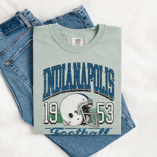 May include a City Football Comfort Colors T-Shirt featuring a football-inspired city graphic, relaxed unisex fit, and casual game-day style.
