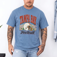 May include a City Football Comfort Colors T-Shirt featuring a football-inspired city graphic, relaxed unisex fit, and casual game-day style.