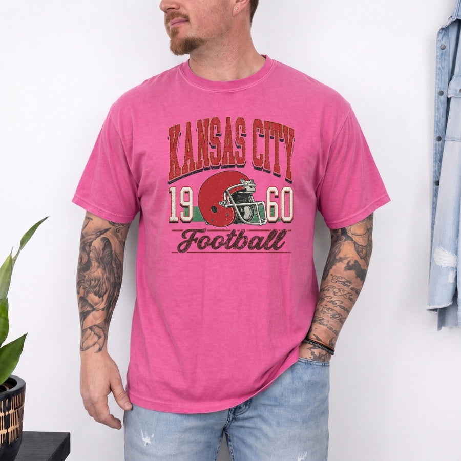 May include a City Football Comfort Colors T-Shirt featuring a football-inspired city graphic, relaxed unisex fit, and casual game-day style.