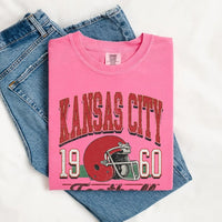 May include a City Football Comfort Colors T-Shirt featuring a football-inspired city graphic, relaxed unisex fit, and casual game-day style.