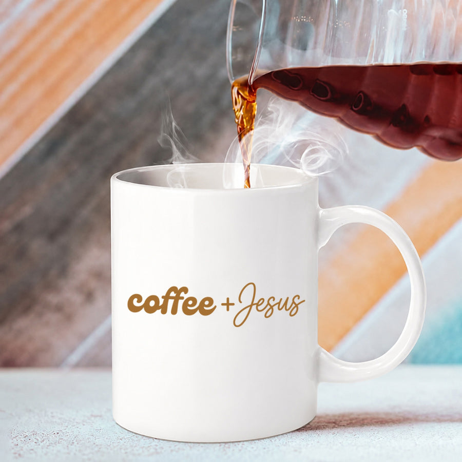 May include a Coffee + Jesus 11oz Mug featuring a simple Christian faith and coffee-inspired statement design on a ceramic cup.