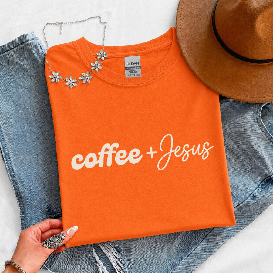 May include a Coffee + Jesus T-Shirt featuring a simple Christian faith and coffee-inspired statement design on a casual short-sleeve tee.