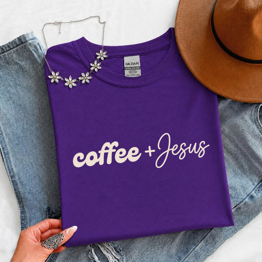 May include a Coffee + Jesus T-Shirt featuring a simple Christian faith and coffee-inspired statement design on a casual short-sleeve tee.