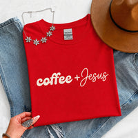 May include a Coffee + Jesus T-Shirt featuring a simple Christian faith and coffee-inspired statement design on a casual short-sleeve tee.
