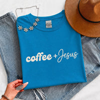 May include a Coffee + Jesus T-Shirt featuring a simple Christian faith and coffee-inspired statement design on a casual short-sleeve tee.