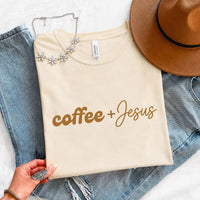 May include a Coffee + Jesus T-Shirt featuring a simple Christian faith and coffee-inspired statement design on a casual short-sleeve tee.