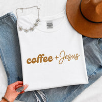 May include a Coffee + Jesus T-Shirt featuring a simple Christian faith and coffee-inspired statement design on a casual short-sleeve tee.