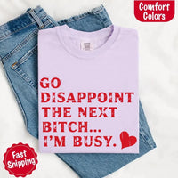 May include bold red distressed typography with the phrase “Go Disappoint The Next Bitch… I’m Busy.” alongside a red heart, expressing sass, confidence, and attitude.