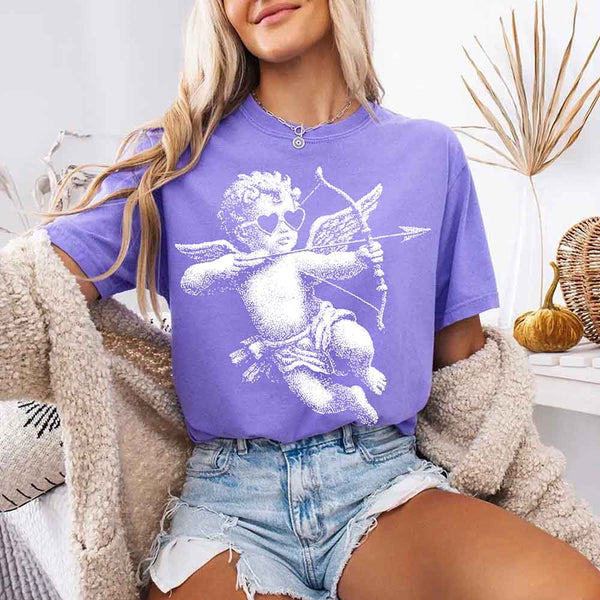 May include a Comfort Colors unisex T-shirt with a halftone pixel art Cupid Valentine’s Day graphic.