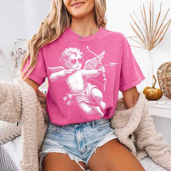 May include a Comfort Colors unisex T-shirt with a halftone pixel art Cupid Valentine’s Day graphic.
