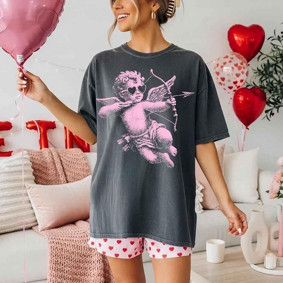 May include a Comfort Colors unisex T-shirt with a halftone pixel art Cupid Valentine’s Day graphic.