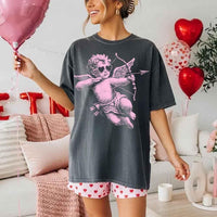 May include a Comfort Colors unisex T-shirt with a halftone pixel art Cupid Valentine’s Day graphic.