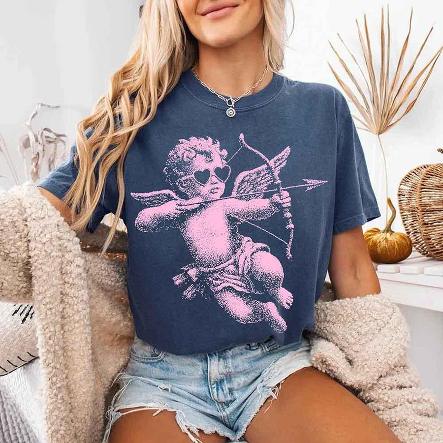 May include a Comfort Colors unisex T-shirt with a halftone pixel art Cupid Valentine’s Day graphic.