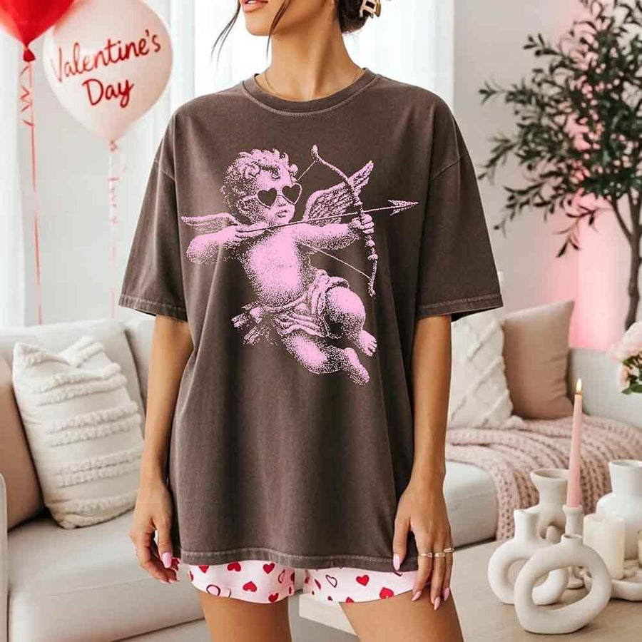 May include a Comfort Colors unisex T-shirt with a halftone pixel art Cupid Valentine’s Day graphic.