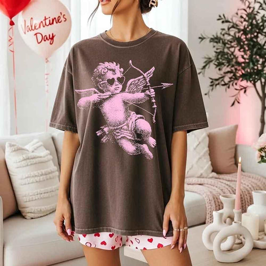 May include a Comfort Colors unisex T-shirt with a halftone pixel art Cupid Valentine’s Day graphic.