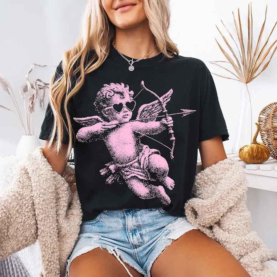 May include a Comfort Colors unisex T-shirt with a halftone pixel art Cupid Valentine’s Day graphic.