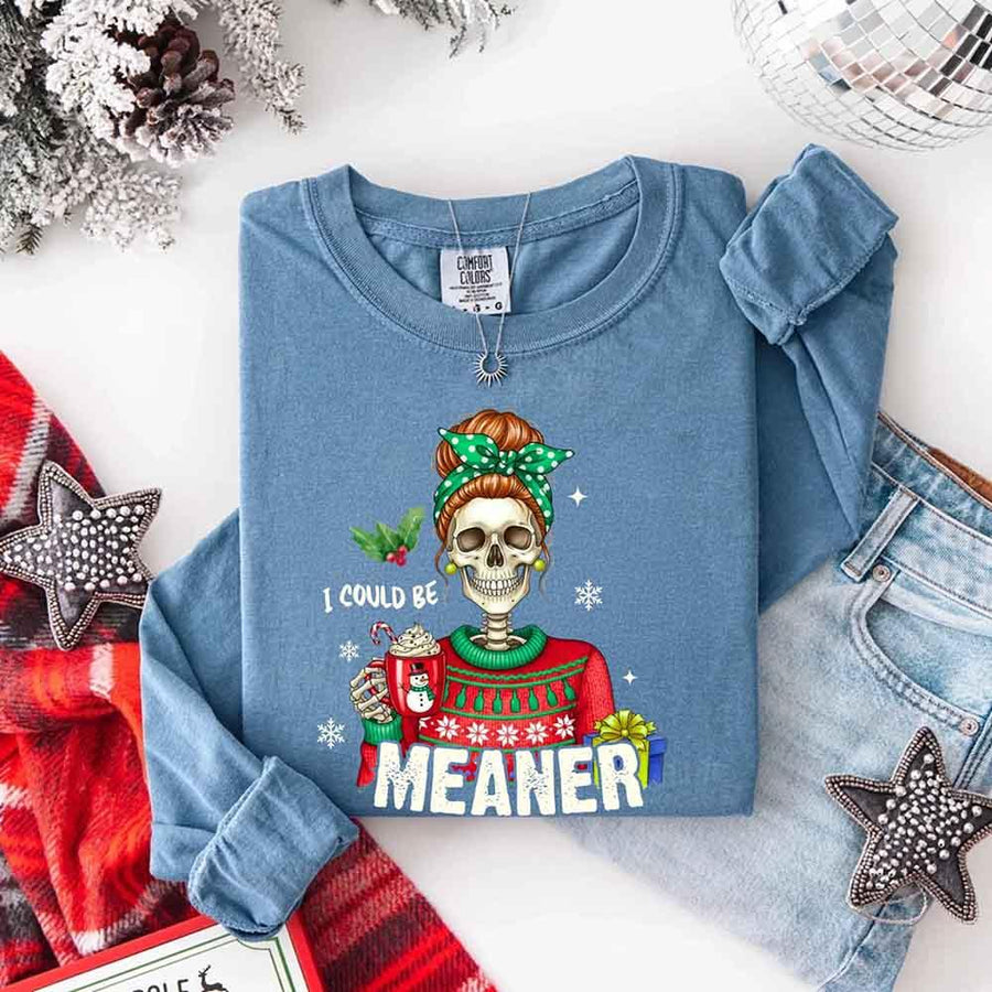 May include a Comfort Colors long sleeve shirt featuring the phrase “I Could Be Meaner” in festive Christmas design, displayed flat with soft cotton texture and holiday accents.