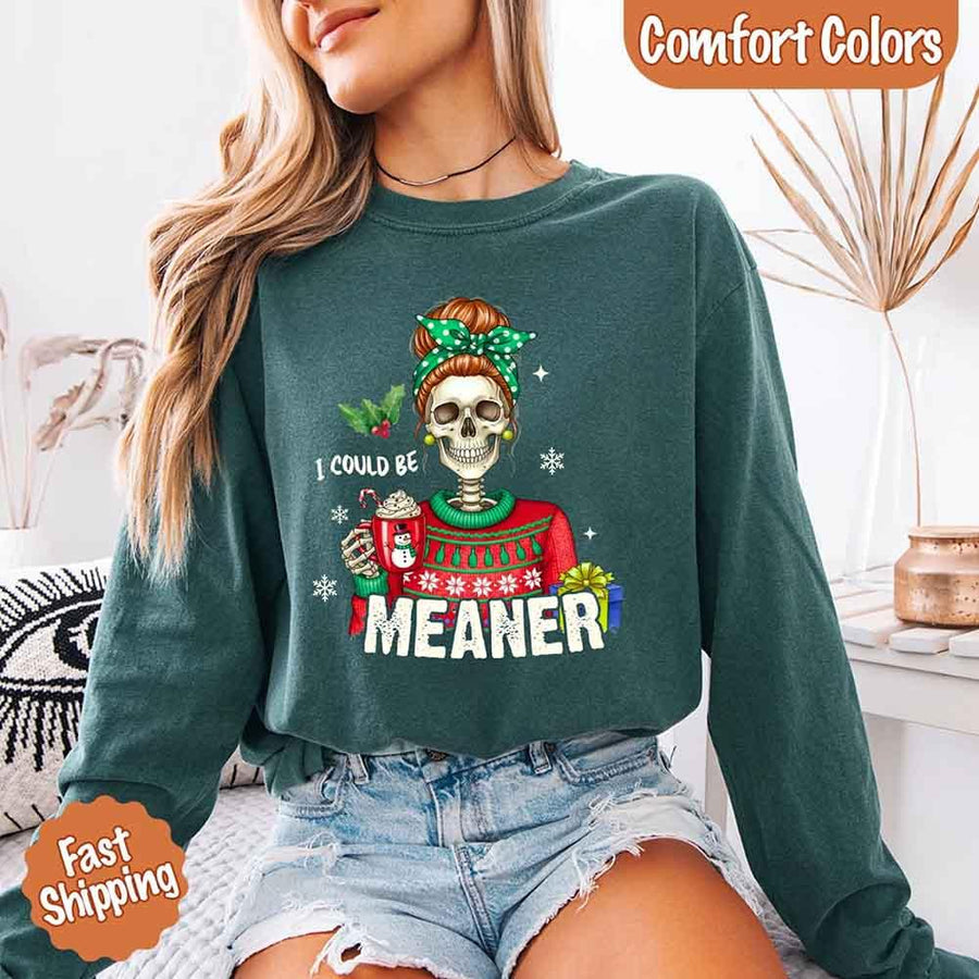 May include a Comfort Colors long sleeve shirt featuring the phrase “I Could Be Meaner” in festive Christmas design, displayed flat with soft cotton texture and holiday accents.