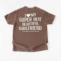 May include a Comfort Colors short-sleeve T-shirt with the phrase I Love My Super Hot Beautiful Girlfriend printed clearly on the front.