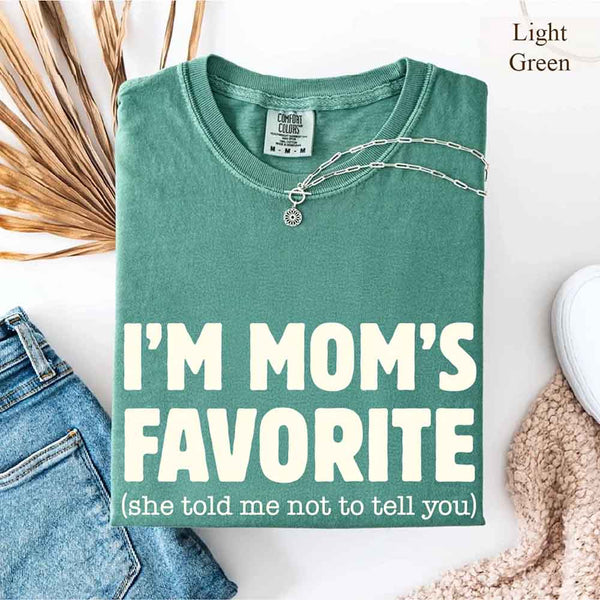 May include a Comfort Colors short-sleeve T-shirt with the phrase I’m Mom’s Favorite printed clearly on the front.