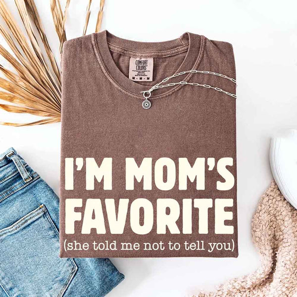 May include a Comfort Colors short-sleeve T-shirt with the phrase I’m Mom’s Favorite printed clearly on the front.