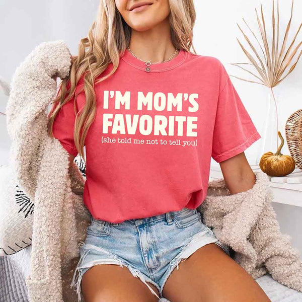 May include a Comfort Colors short-sleeve T-shirt with the phrase I’m Mom’s Favorite printed clearly on the front.