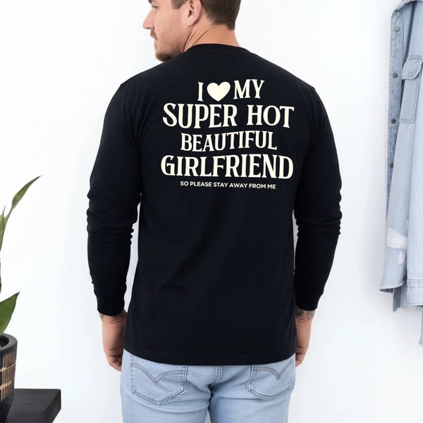 May include a Comfort Colors long sleeve T-shirt with the phrase I Love My Super Hot Beautiful Girlfriend printed at the back.