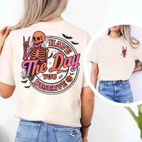 May include skeleton Halloween graphic with holographic lettering ‘Have the Day You Deserve,’ skeleton hand gesture, bats, spider webs, and pumpkin accent – spooky graphic tee design.