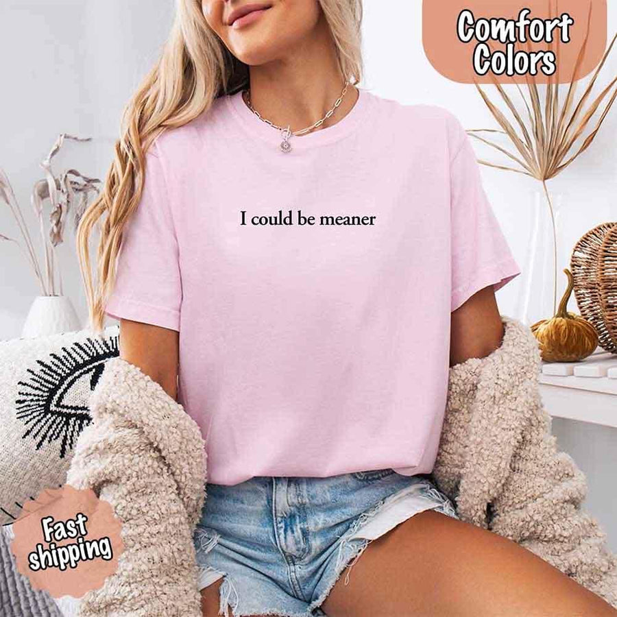 May include a unisex Comfort Colors T-shirt in a relaxed fit with short sleeves and crew neckline, featuring the phrase “I Could Be Meaner” printed across the chest in bold, simple lettering.