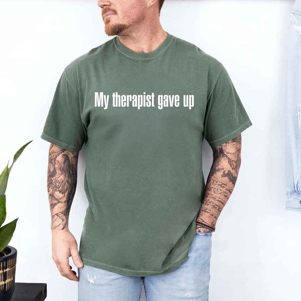 May include a Comfort Colors short-sleeve shirt with the printed phrase My Therapist Gave Up in a simple, bold design.