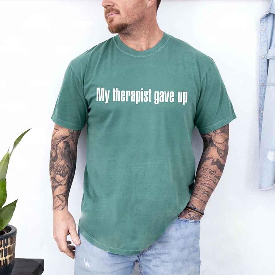 May include a Comfort Colors short-sleeve shirt with the printed phrase My Therapist Gave Up in a simple, bold design.