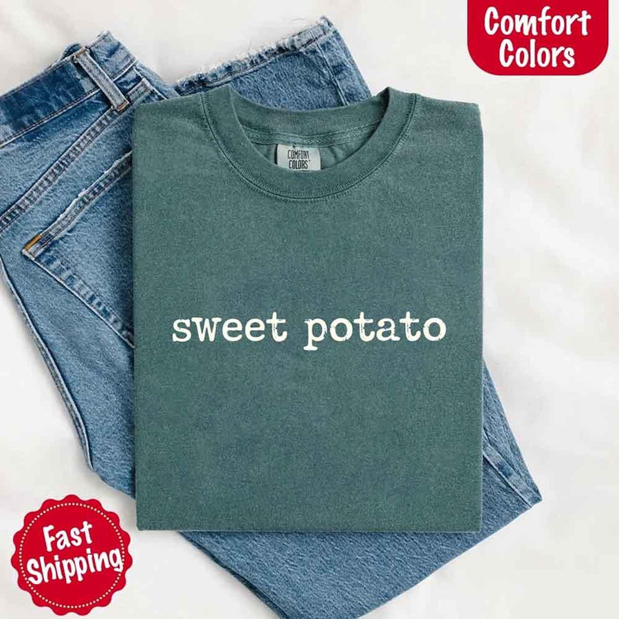May include a pair of matching fall-themed couple t-shirts from Comfort Colors featuring playful “Sweet Potato” and “Rude Potato” designs. The shirts are styled with humorous graphics or text in warm autumn tones, perfect for couples celebrating the season with a lighthearted touch.