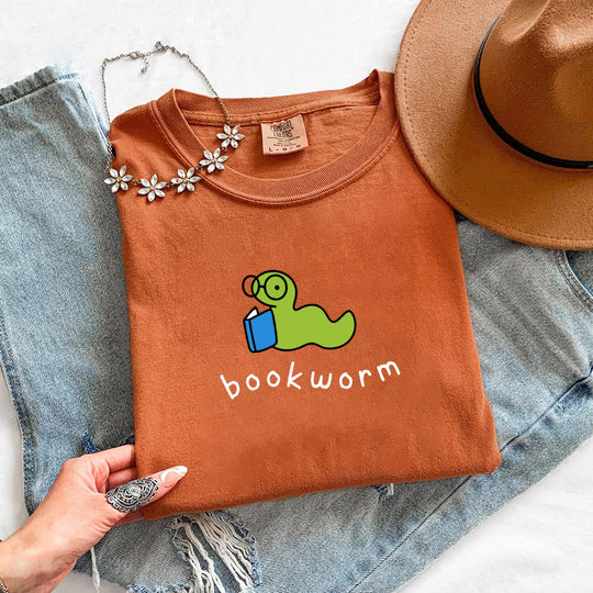 May include Bookworm Comfort Colors unisex t-shirt with book lover graphic, relaxed fit, and soft garment-dyed cotton