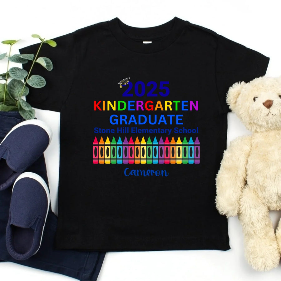 May include colorful text that reads “2025 KINDERGARTEN GRADUATE Stone Hill Elementary School” with a graduation cap over the number “2.” The word "KINDERGARTEN" is in rainbow colors, and the image features a row of multicolored crayons, celebrating a young student’s graduation.
