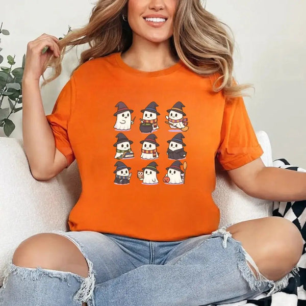 May include a Halloween t-shirt featuring kawaii-style witch ghosts in a spooky-cute design, perfect for fall and Halloween wear.