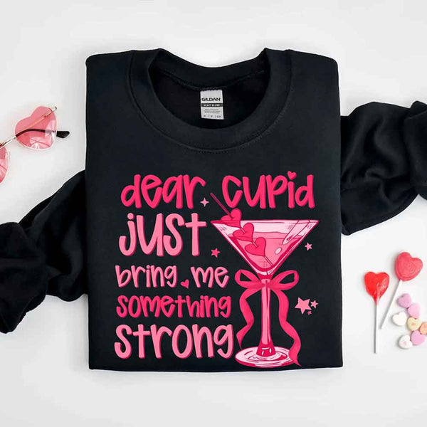 May include a unisex T-shirt with the phrase Dear Cupid Something Strong printed clearly on the front.