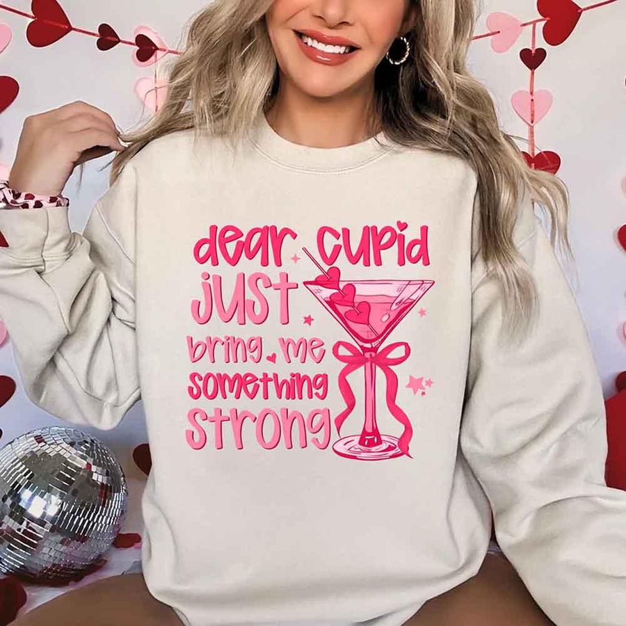 May include a unisex T-shirt with the phrase Dear Cupid Something Strong printed clearly on the front.