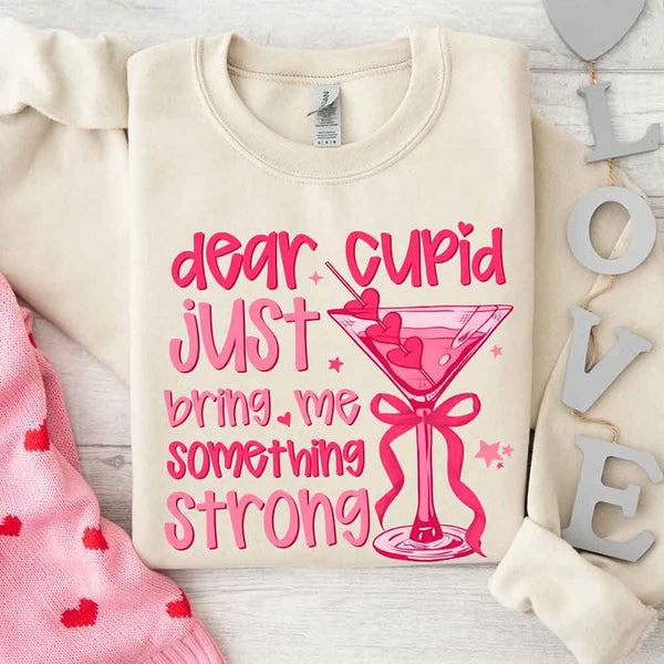May include a unisex T-shirt with the phrase Dear Cupid Something Strong printed clearly on the front.