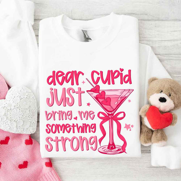 May include a unisex T-shirt with the phrase Dear Cupid Something Strong printed clearly on the front.