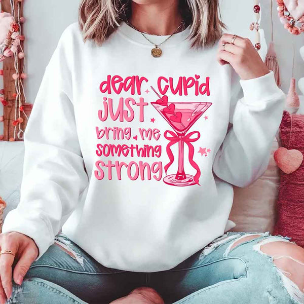 May include a unisex T-shirt with the phrase Dear Cupid Something Strong printed clearly on the front.