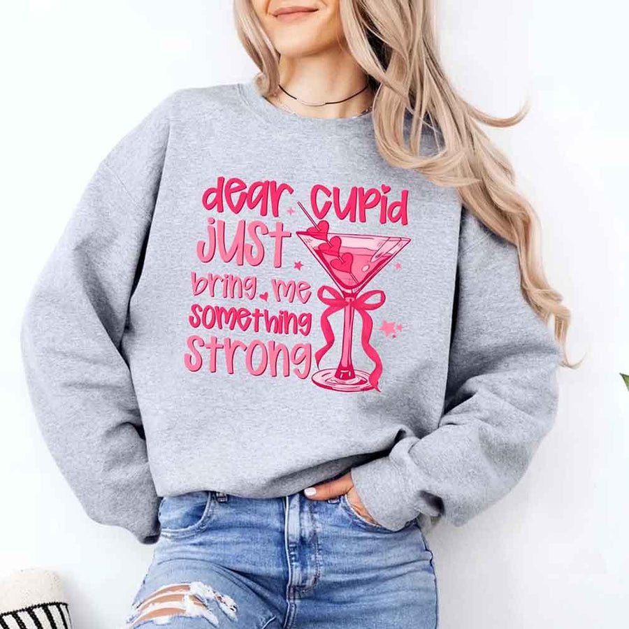 May include a unisex T-shirt with the phrase Dear Cupid Something Strong printed clearly on the front.