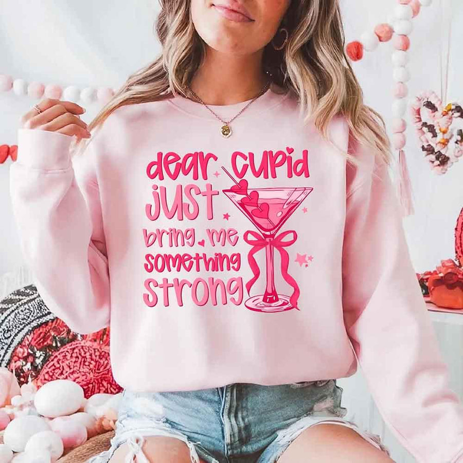 May include a unisex T-shirt with the phrase Dear Cupid Something Strong printed clearly on the front.
