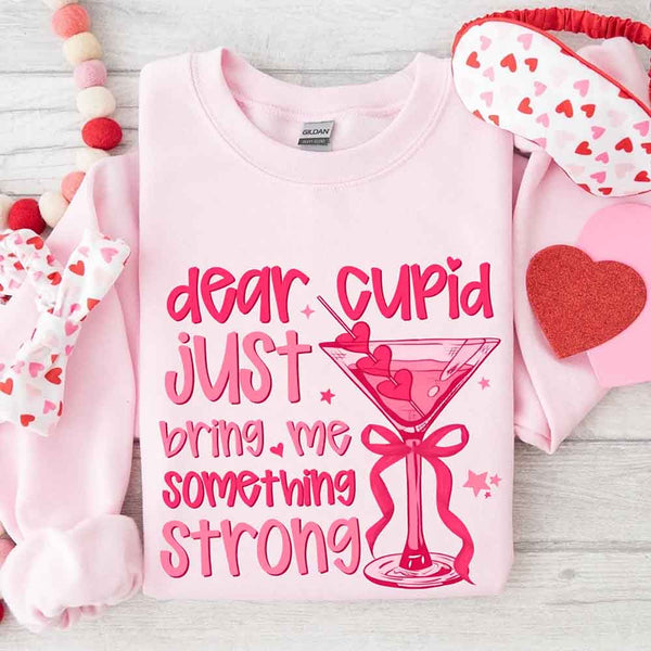 May include a unisex T-shirt with the phrase Dear Cupid Something Strong printed clearly on the front.